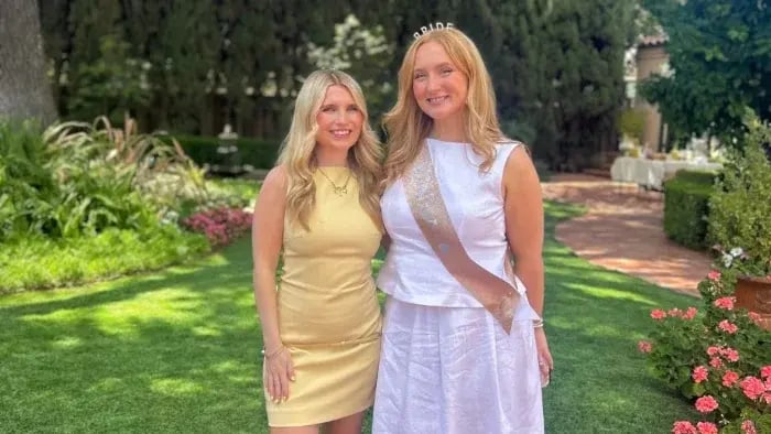 two girls standing next to each other